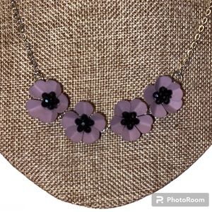 Necklace. Floral 3 dimensional, purple rhinestones inside petals. Silver tone